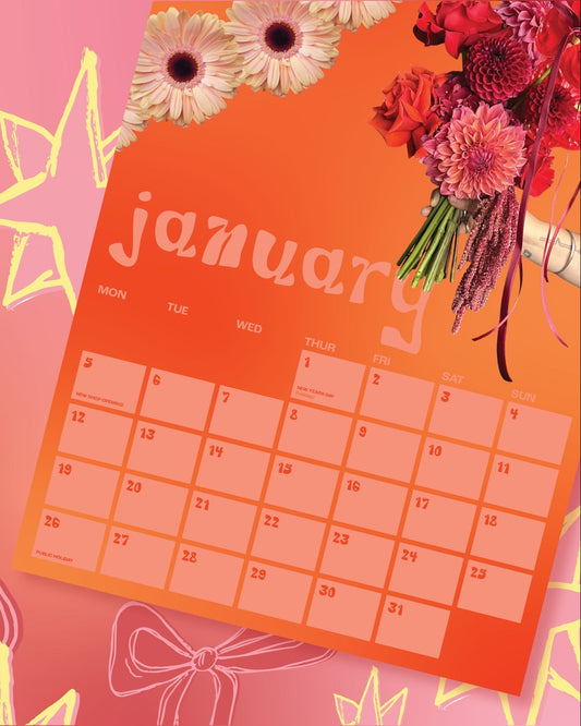 Promotional image for 2026 calendars with a calendar page and floral arrangements on a pink background.