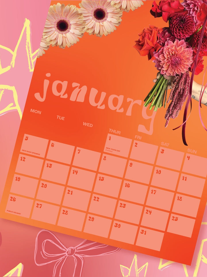 Promotional image for 2026 calendars with a calendar page and floral arrangements on a pink background.