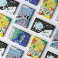 Load image into Gallery viewer, A collection of colorful chocolate bars with illustrated packaging, labeled 'OTHERLY Vegan Chocolate' in various flavors.
