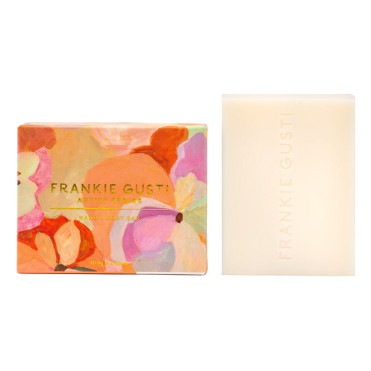 Bar of soap with floral packaging and visible brand name on a white background