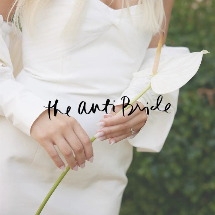 woman holding white flower